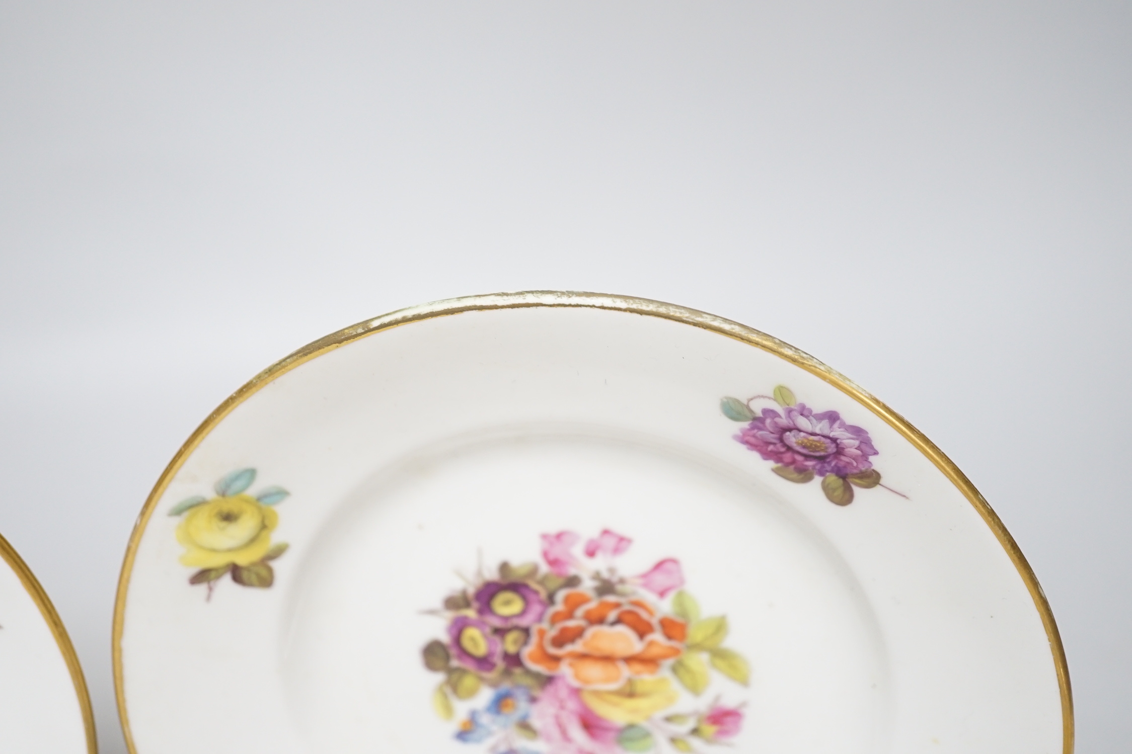 A pair of 19th century Derby floral small plates with gilded decoration, probably painted by Webster, c.1820, each 17cm in diameter